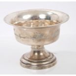 Middle Eastern white metal dish of circular form, with flared rim and engraved river scene,