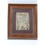 George III small needlework sampler dated 1778, with Royal cypher and animal and floral motifs,