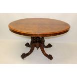 Victorian figured walnut loo table with oval quarter-veneered tilt-top raised on four column