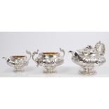 Fine quality George IV silver three piece tea set - comprising teapot of compressed melon form,