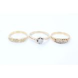Three gold and diamond rings - various - to include a single stone diamond estimated to weigh