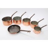 Graduated set of six antique copper pans - comprising five pans and one saucepan,