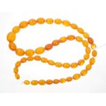 Old amber bead necklace with a string of graduated amber beads.