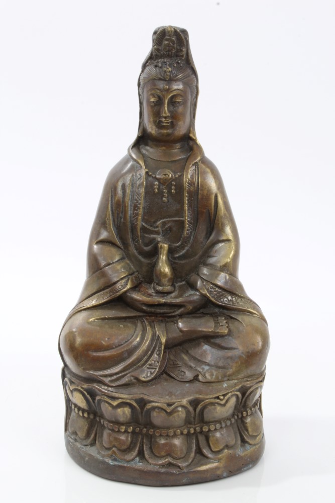 Chinese bronze figure of Guanyin seated on lotus flower base - character mark to base, 16.