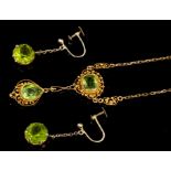 Victorian peridot pendant necklace with a pear-shape drop suspended from an oval mixed cut peridot,