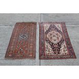 Persian-style rug with central medallion against cream ground and allover branchwork ornament