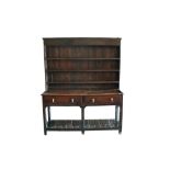Early 18th century oak high dresser with boarded shelved rack,