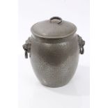 Early 20th century Tudric pewter biscuit barrel and cover of swollen cylindrical form,