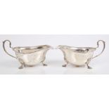 Pair 1930s silver sauce boats of conventional form, with bead borders and scroll handles,