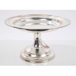 Victorian silver tazza of circular form, on a tall circular pedestal foot (London 1883),