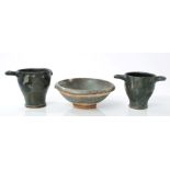 Two Ancient Roman pottery two-handled wine cups with dark grey lustre glaze,