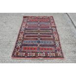 Persian-style rug centred by seven geometric bands in geometric borders,