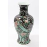 Early 20th century Chinese famille noire vase with polychrome painted bird,