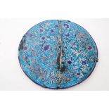 Antique Islamic tin glazed pottery charger with blue and white floral decoration,