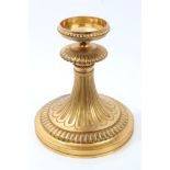Gilt metal stand by Baccarat of knopped fluted form, on spread circular foot, stamped - 'BACCARAT',