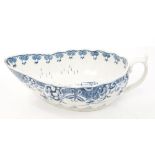 18th century Worcester fluted blue and white sauce boat with painted doughnut tree and Chinese
