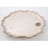 Contemporary silver salver of shaped hexagonal form, with piecrust border,