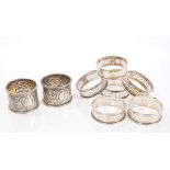 Pair Victorian silver napkin rings with embossed scroll and floral decoration and bead borders