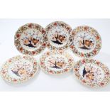 Six early 19th century Derby plates with Imari palette floral decoration - red painted marks,