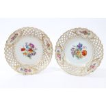 Pair 19th century Meissen dessert plates with polychrome painted floral reserves with reticulated