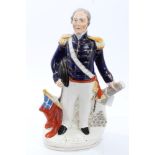 Victorian Staffordshire figure of Admiral Dundas in uniform, with cannon and flag supports,