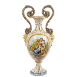 19th century Italian Majolica vase with double-scroll snake handles and demon mask mounts,