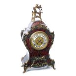 19th century mantel clock in the Louis XV style, with eight day movement striking on a gong,