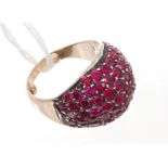 Art Deco cocktail ring of bombe form, with pavé set rubies, possibly synthetic,