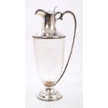Fine quality Edwardian clear glass claret jug in the form of a classical urn,