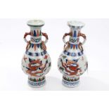 Pair Chinese Transitional-style vases with green, blue and iron-red dragon and phoenix decoration,