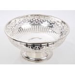 Early George V silver dish of circular form, with pierced Greek key pattern decoration,