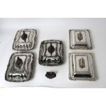 Three early 19th century Old Sheffield Plate entrée dishes and covers of shaped rectangular form,