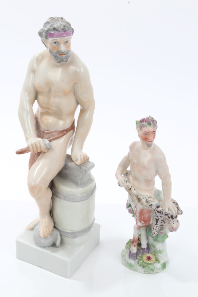 Early 19th century Continental porcelain figure of a semi-clad blacksmith with hammer and anvil,