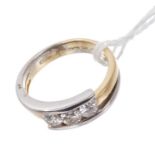 Contemporary diamond three stone crossover ring with three brilliant cut diamonds estimated to