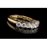 Diamond seven stone eternity ring with seven brilliant cut diamonds in claw setting,