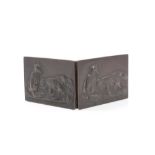 An unusual Victorian rectangular bronze folding card case with embossed fox family panels to both