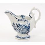 18th century Derby blue and white helmet-shaped cream jug with moulded shell decoration and scroll