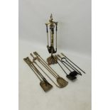 Set of four brass fire irons on stand, 81cm high,