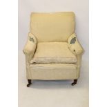 Early 20th century upholstered easy chair in the manner of Howard & Son,