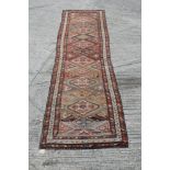 Kasak runner with staggered lozenge medallions in geometric borders,