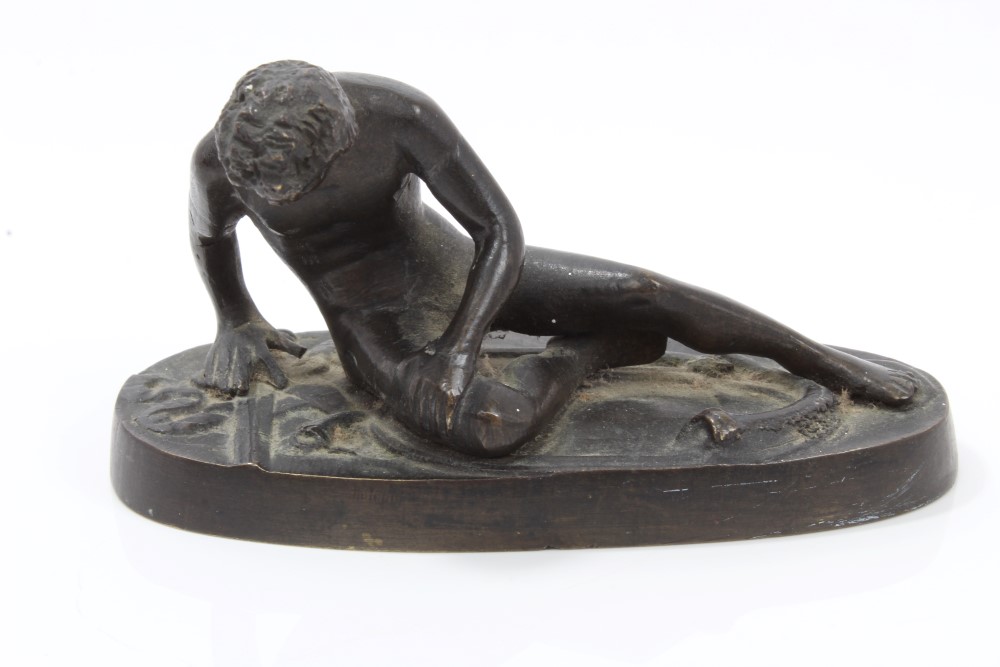 19th century Continental bronze figure of The Dying Gaul after the antique, on oval plinth,