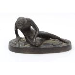 19th century Continental bronze figure of The Dying Gaul after the antique, on oval plinth,