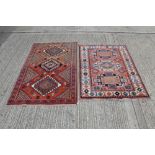 Persian-style rug with three geometric medallions and salmon-pink ground in geometric borders,