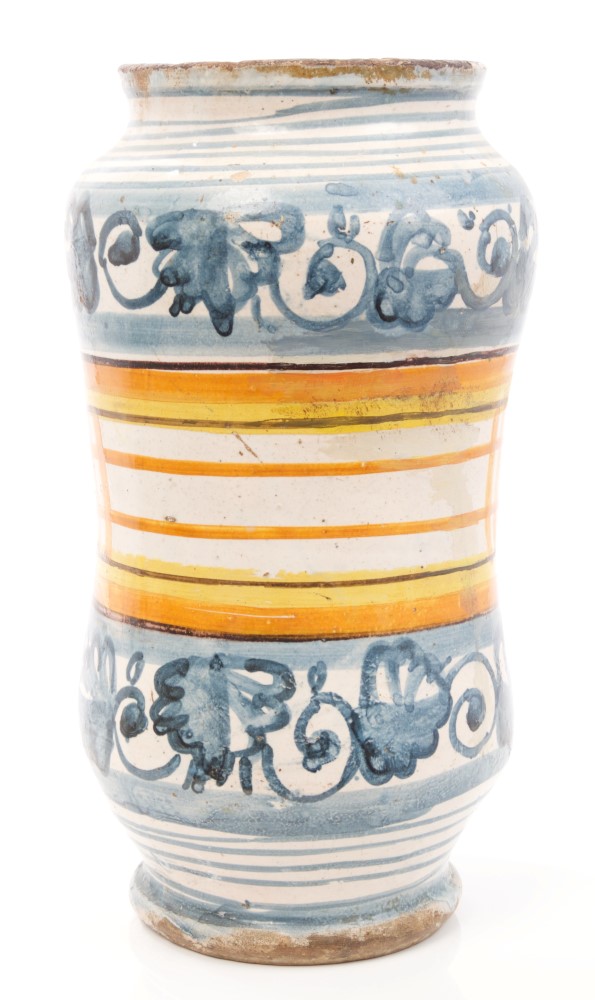 17th century Italian Majolica drug jar with blue and white floral decoration and green and yellow