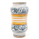 17th century Italian Majolica drug jar with blue and white floral decoration and green and yellow
