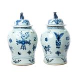 Pair 19th century Chinese export baluster-shaped vases and covers with Dog of Foo knops,