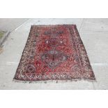 Large Eastern rug, centred by three conjoined lozenge medallions,