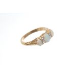 Edwardian gold (18ct) opal and diamond ring with three oval opal cabochons interspaced by four old