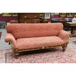 19th century walnut and parcel gilt settee with broad upholstered seat and overscroll ends,
