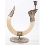 Indian white metal mounted boar's tusk candlestick in the form of a cobra,